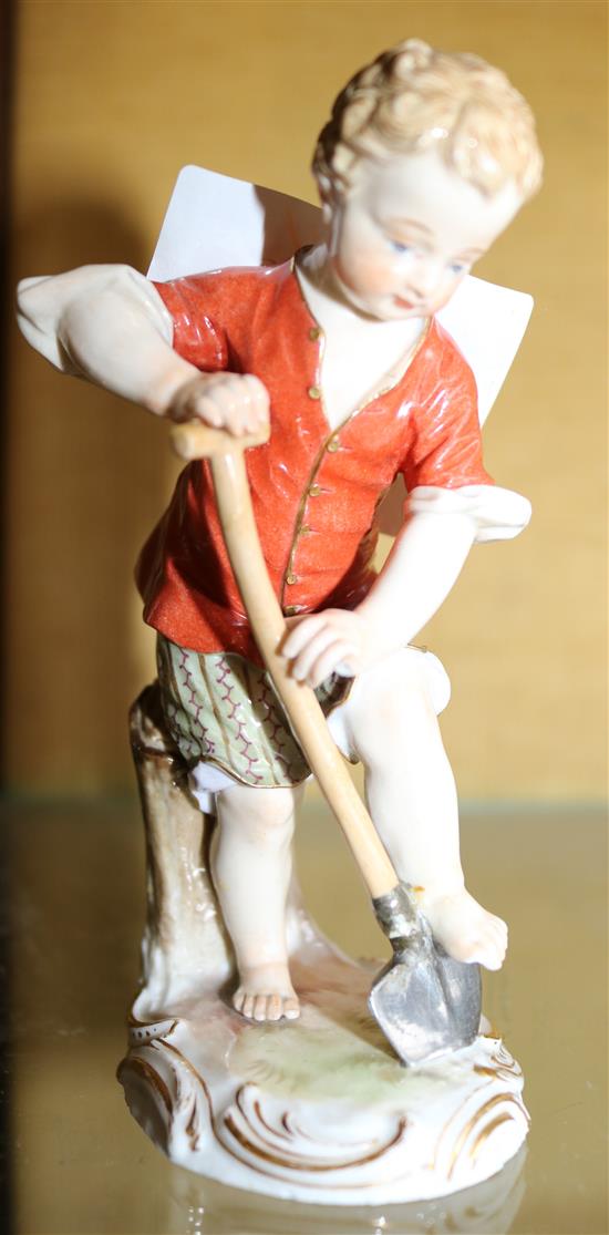 Porcelain figure of boy digging